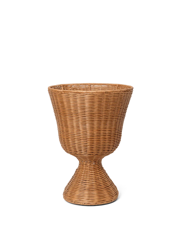 Wicker plant stand on a white background