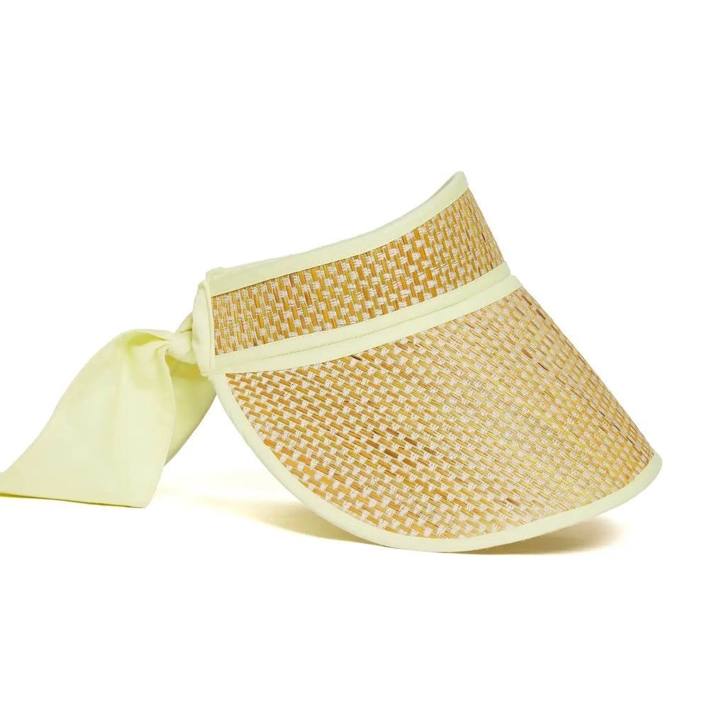 Yellow woven visor with a ribbon on a white background