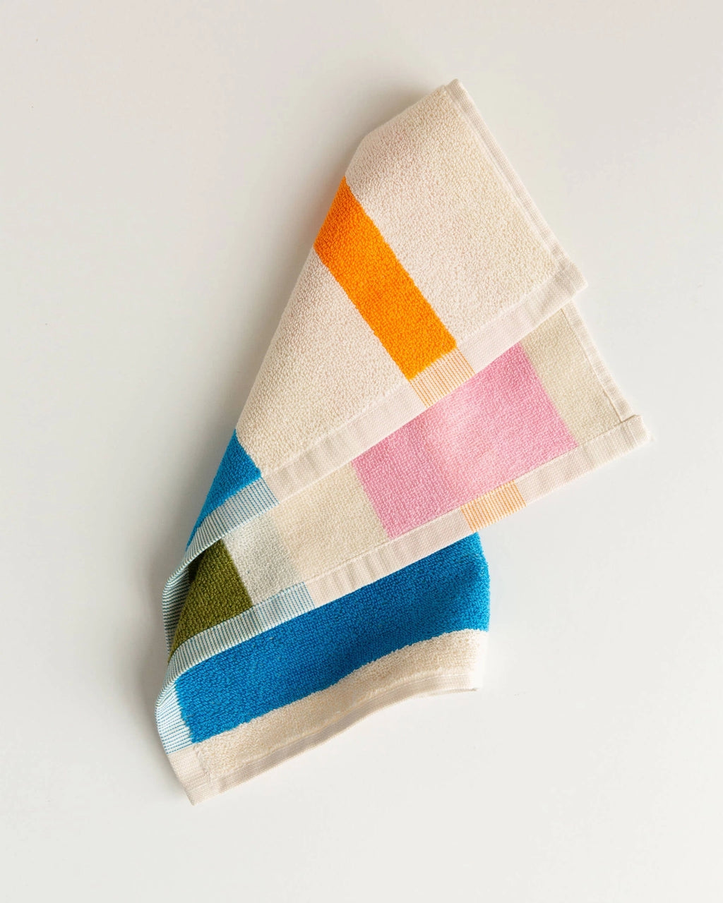 Colorful patterned towel on a light gray background