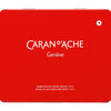 A square red metal tin of Caran d'Ache Genève, featuring the brand name in white text and a small white geometric logo in the top right corner, set against a plain white background.