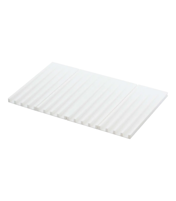 A white rectangular corrugated silicone drying mat with a ribbed surface, shown at an angle on a plain white background.