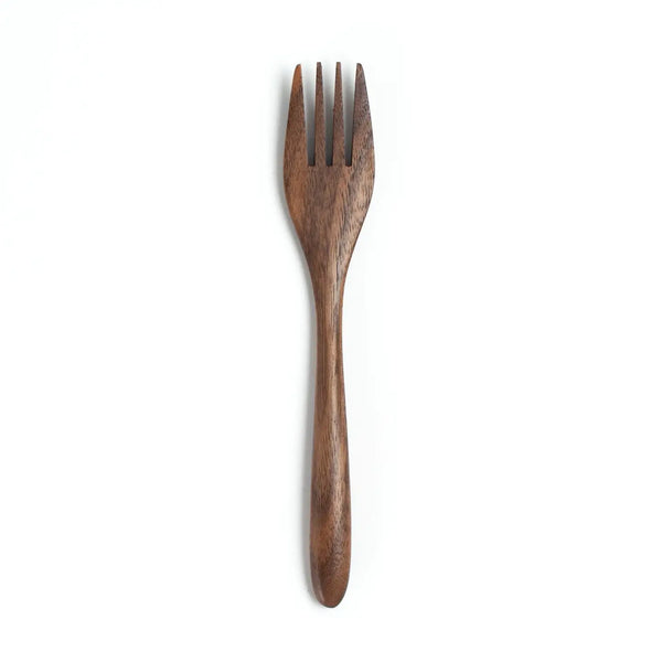 Wooden fork on a white background