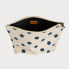 Beige pouch with blue polka dots on a white background