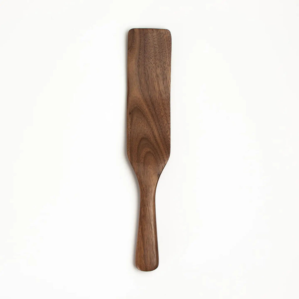 Wooden spatula on a white background