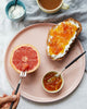 porcelain dinner plate with grape fruit and toast