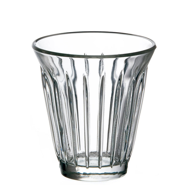 Clear glass tumbler with vertical ridges on a white background