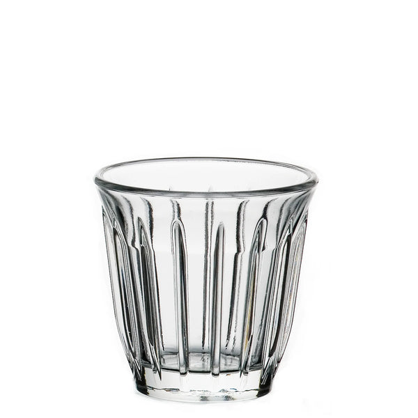 Clear glass tumbler with vertical ridges on a white background