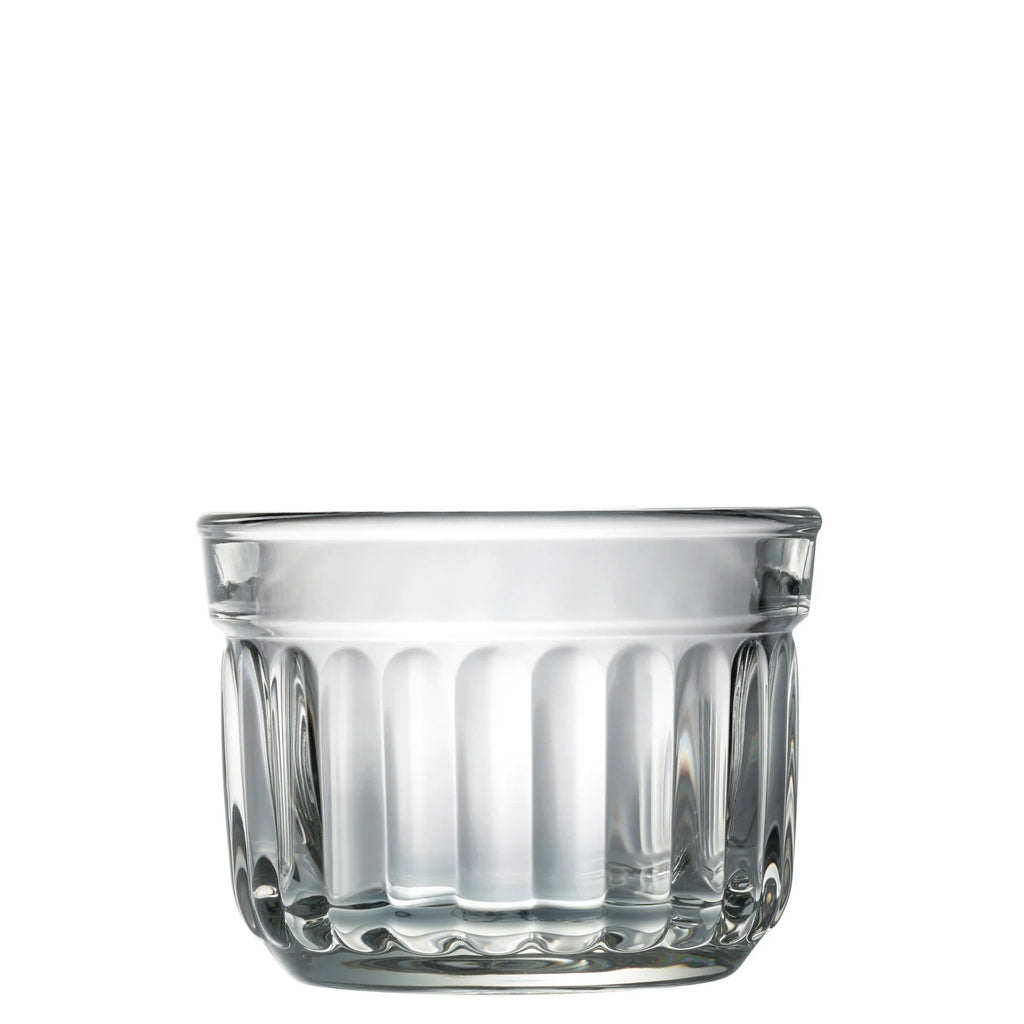 Clear glass tumbler with textured design on a white background