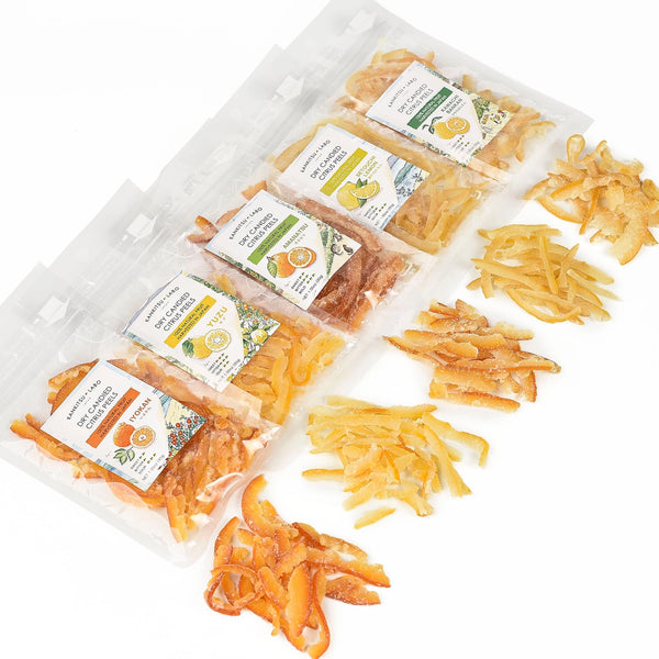 Packaged dried citrus strips with labels on a white background