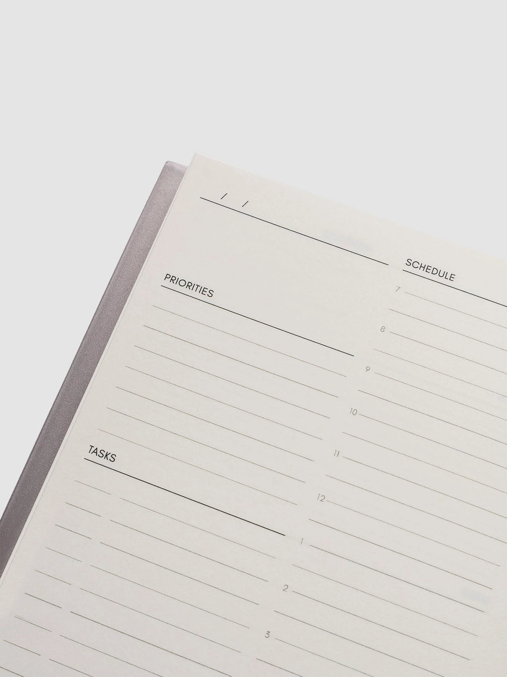 Planner with sections for priorities, schedule, and tasks on a white background