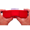 Red ice cube tray held by hands against a white background