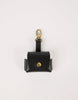 Black leather air pod case with gold accents on a white background