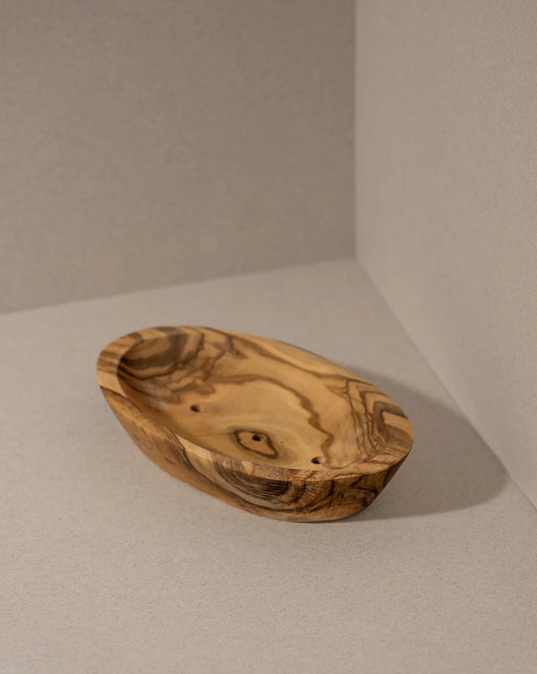 Wooden soap dish with natural grain on a neutral background