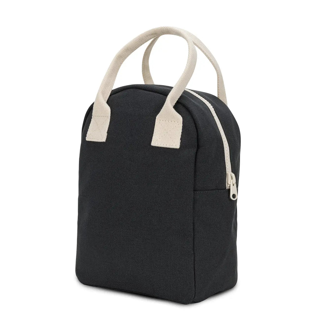 Black bag with beige handles and zipper on a white background