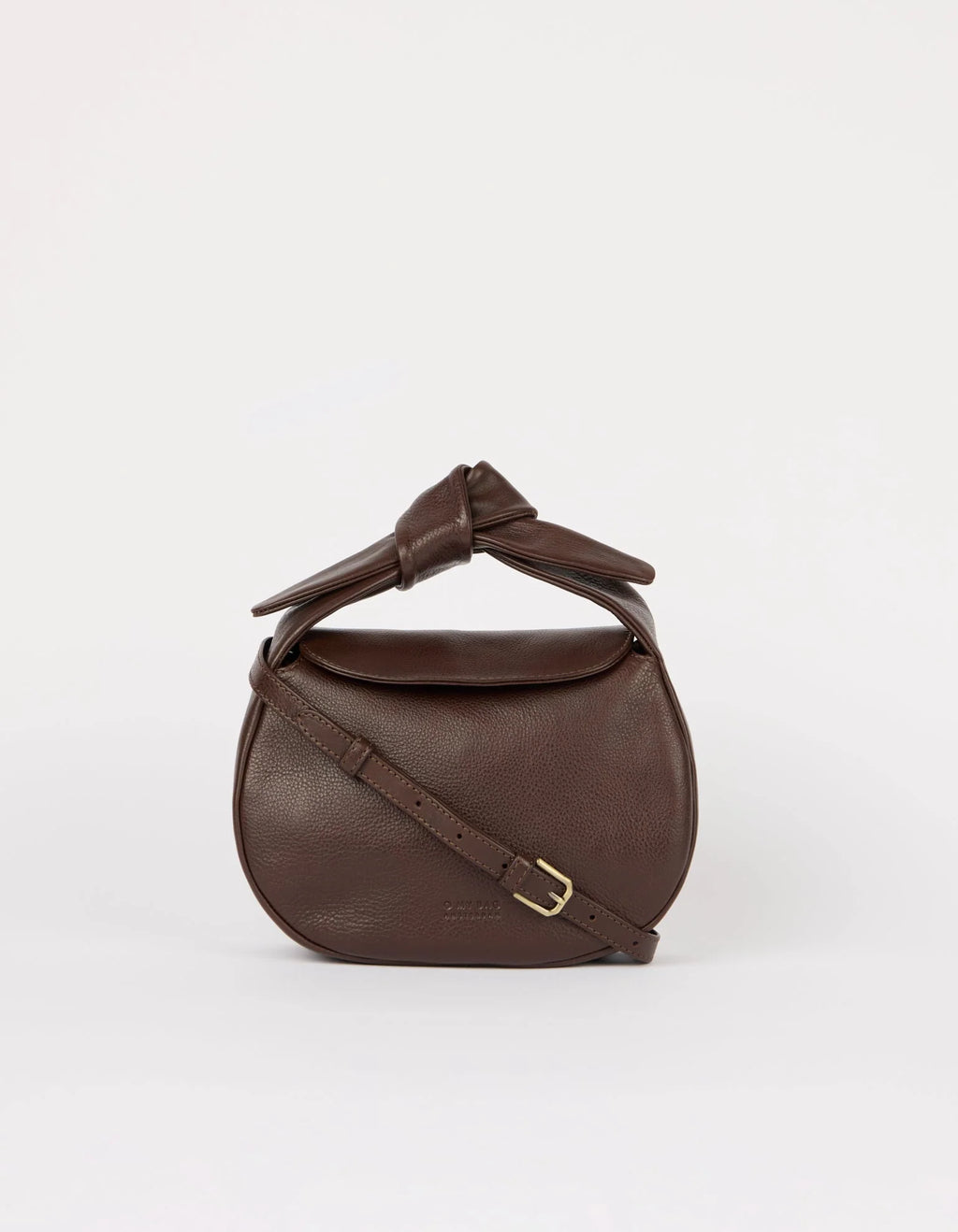 Brown leather handbag with a knot detail on a white background