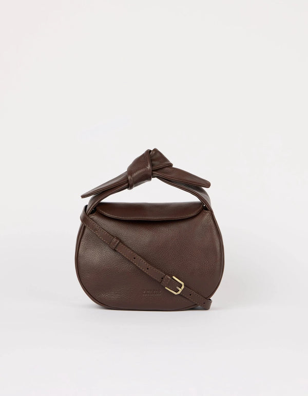Brown leather handbag with a knot detail on a white background
