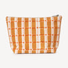 Plaid patterned pouch with orange and white lines on a light gray background
