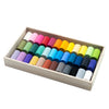 Set of colorful pastels in a wooden box on a white background