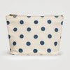 Canvas pouch with blue polka dots on a white background