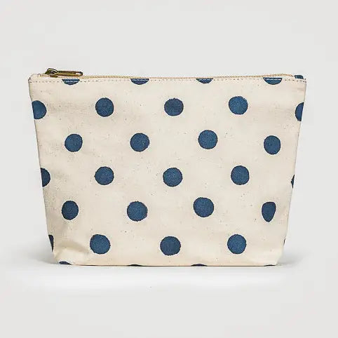 Canvas pouch with blue polka dots on a white background