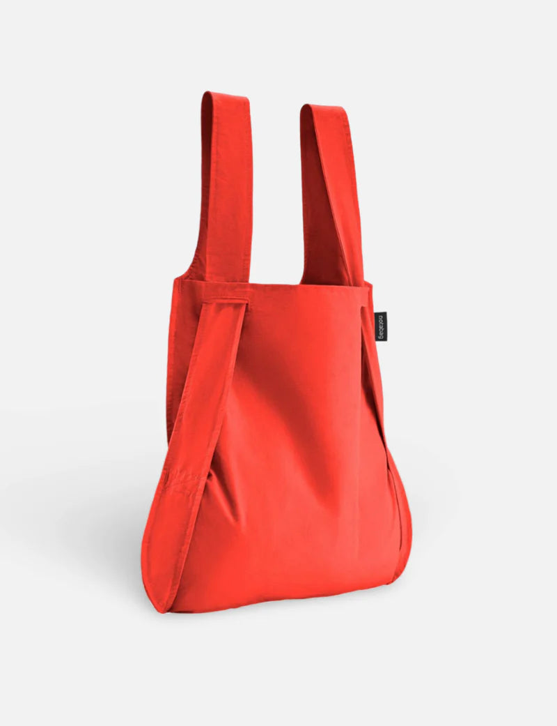 Red backpack on a light gray background