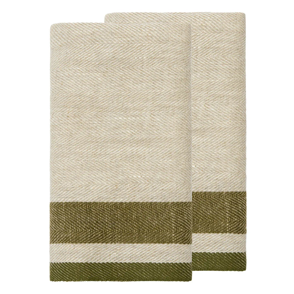 Two folded woven towels in a natural beige color with a horizontal olive green and cream stripe pattern near the bottom, displayed on a solid white background.