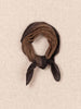 Brown scarf tied into a knot on a beige textured background