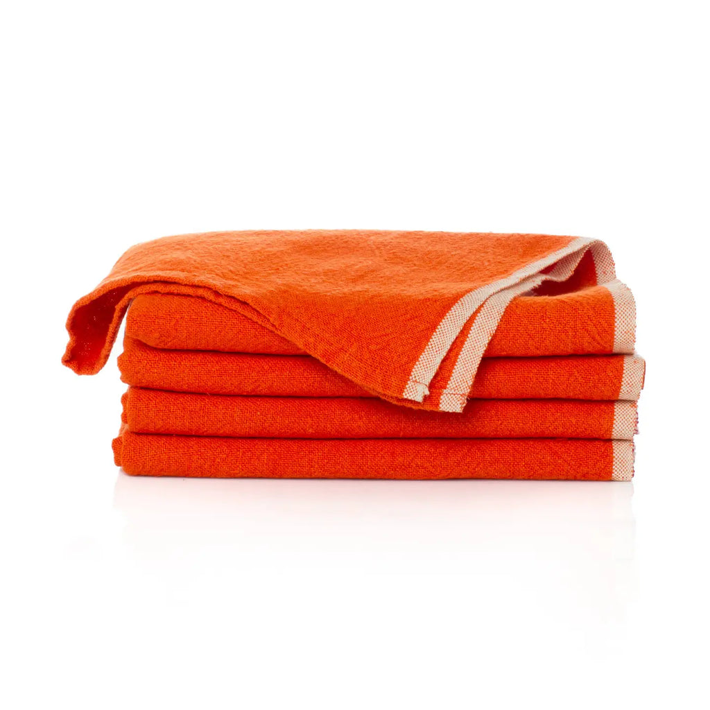 Stack of orange towels on a white background