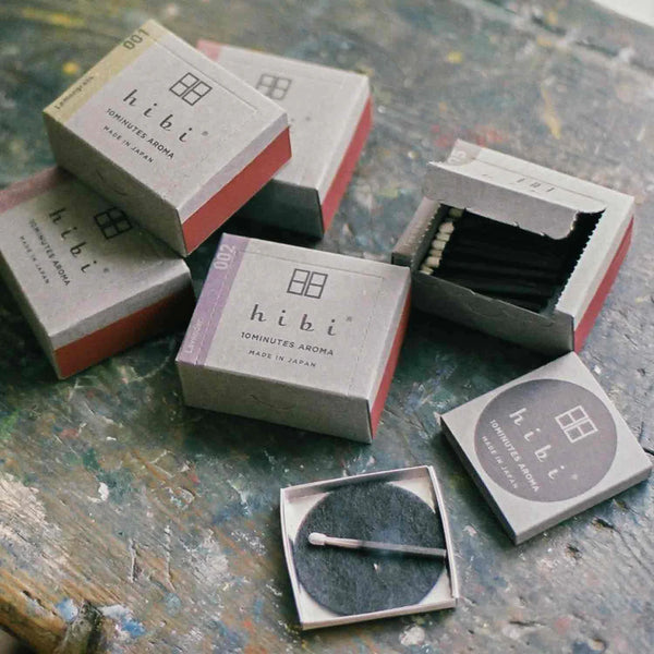 hibi incense boxes on a textured surface