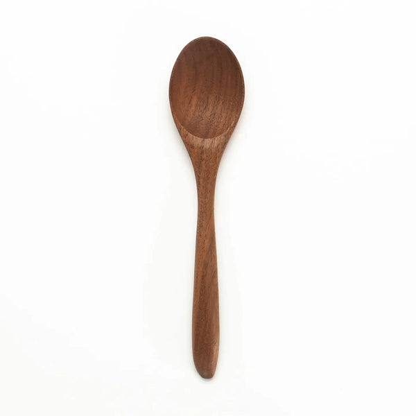 Wooden spoon on a white background