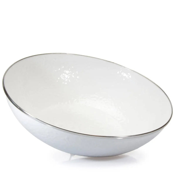 White enamel bowl with a silver rim on a white background