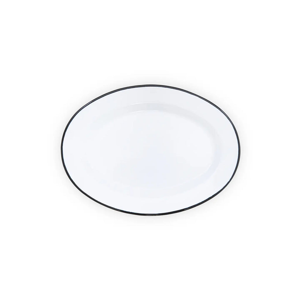 Oval white plate with black rim on a white background