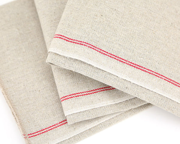 Beige napkins with red stripes on a white background