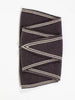 Folded brown fabric with beige stripes on a white background