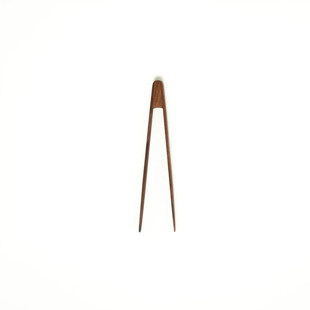Wooden tongs on a white background