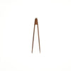 Wooden tongs on a white background