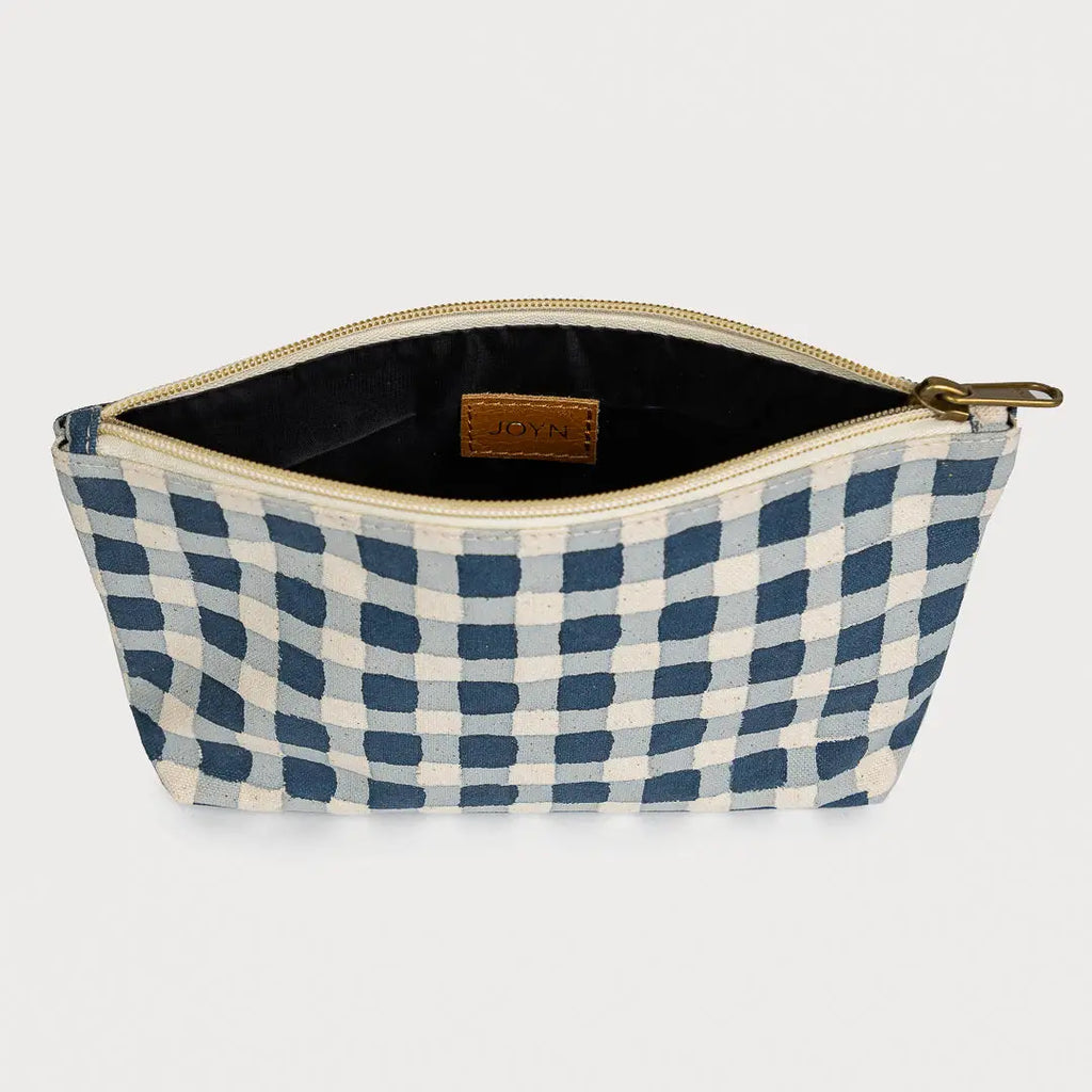 Blue and white checkered pouch with a gold zipper on a light gray background