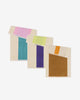 Four colorful towels with different color combinations on a white background
