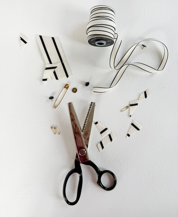 Scissors and decorative items on a white background